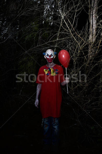 scary evil clown in the woods at night Stock photo © nito