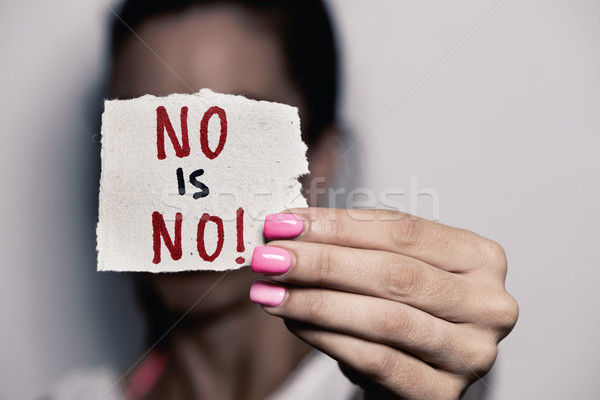 woman showing a note with the text no is no Stock photo © nito
