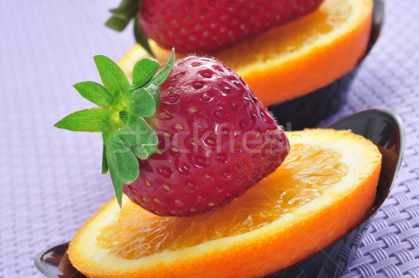 strawberries and orange slices Stock photo © nito