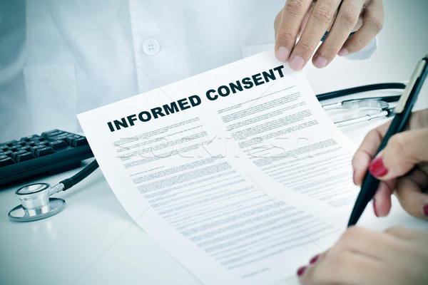 young woman signing an informed consent Stock photo © nito