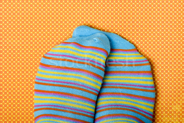 someone rubbing his or her feet wearing colorful socks Stock photo © nito