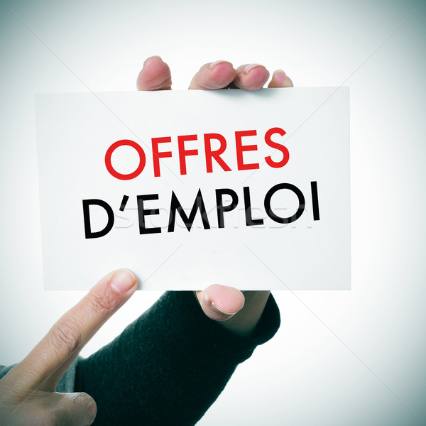 woman with a signboard with the text offres d'emploi, jobs in fr Stock photo © nito