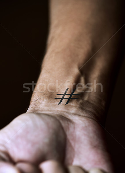 hash tag in the wrist of a man Stock photo © nito
