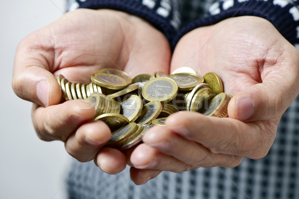 Jeune homme euros pièces mains jeunes [[stock_photo]] © nito