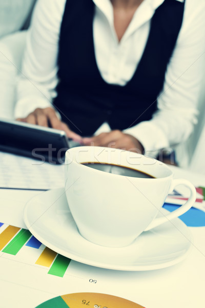 businesswoman using an electronic calculator in her office Stock photo © nito