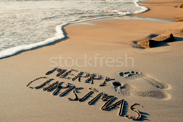 text merry christmas in the sand of a beach Stock photo © nito
