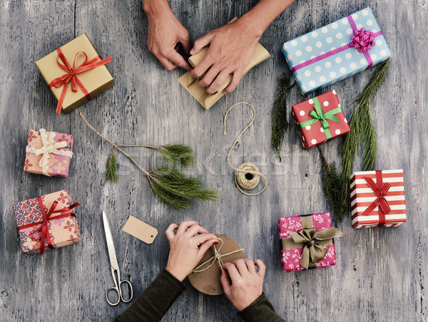 young woman and man wrapping gifts Stock photo © nito