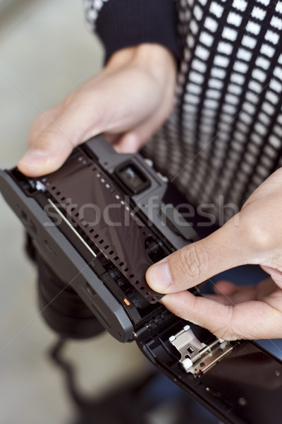 man changing the roll film of his camera Stock photo © nito