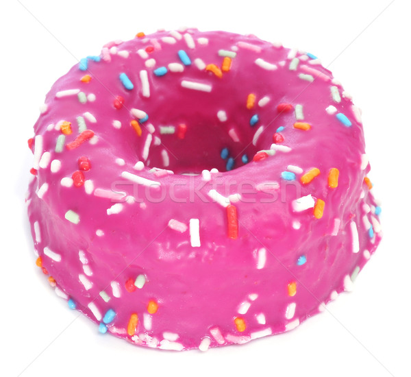 Stock photo: donut coated with a pink frosting and sprinkles of different col