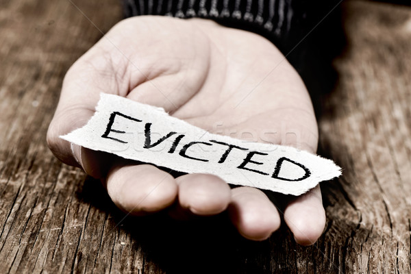 man with a piece of paper with the word evicted Stock photo © nito