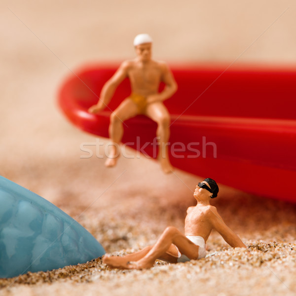 miniature men in swimsuit on the beach Stock photo © nito