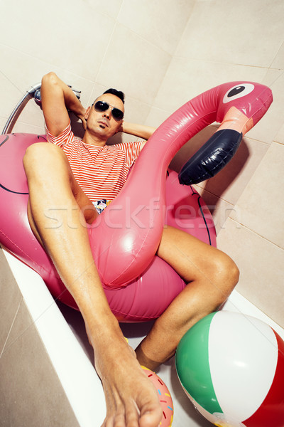 man with a swim ring relaxing in the bathroom Stock photo © nito