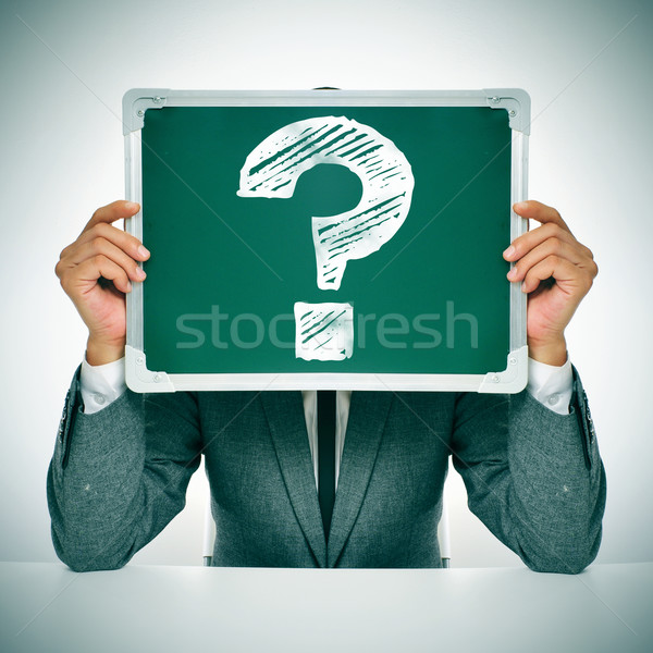 man in suit with a question mark in a chalkboard Stock photo © nito