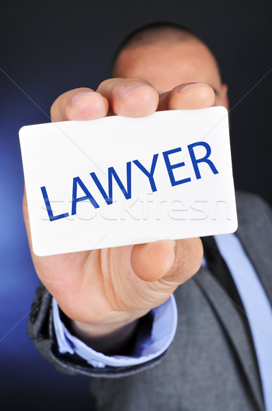 Stock photo: man showing a signboard with the word lawyer