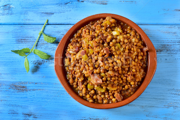 spanish lentil stew on a blue wooden table Stock photo © nito