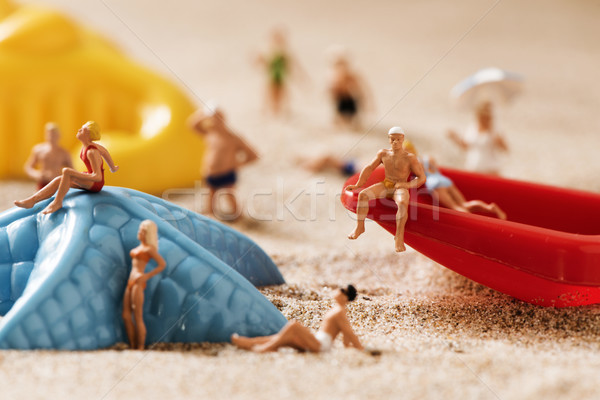 miniature people in swimsuit on the beach Stock photo © nito