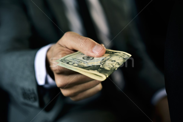 man with a wad of dollar bills in a car Stock photo © nito