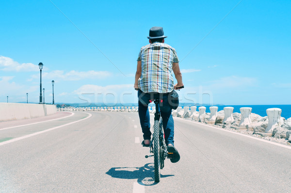 young man riding a bike Stock photo © nito
