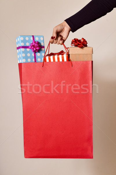 woman with a shopping bag full of gifts Stock photo © nito