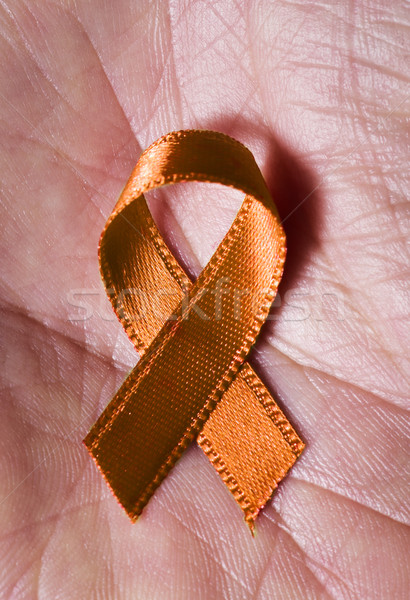 orange ribbon on the palm Stock photo © nito