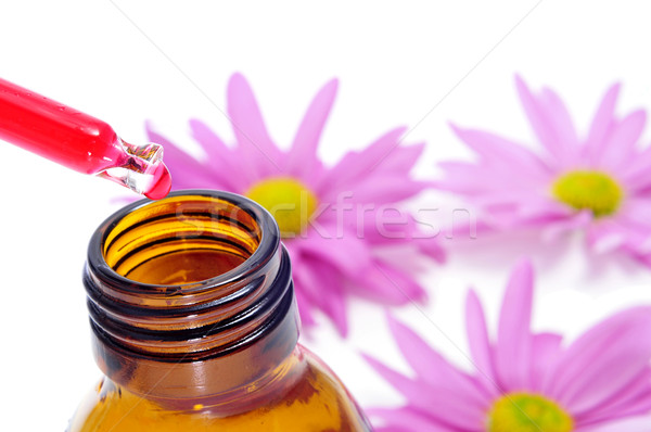 Homeopátia cseppentő üveg rózsaszín virágok háttér Stock fotó © nito