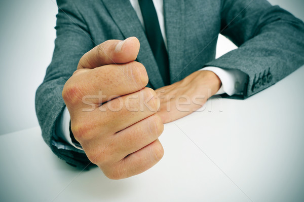 man in suit banging his fist on the desk Stock photo © nito