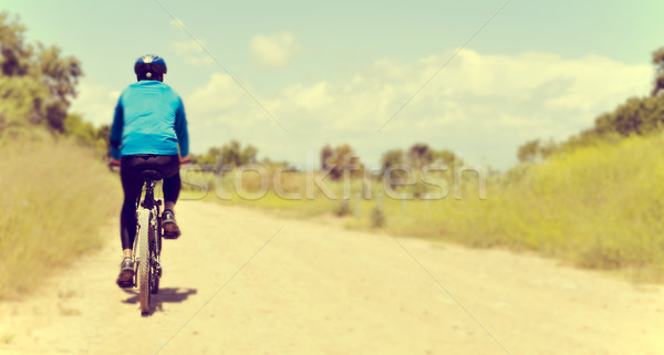 young man riding a mountain bike Stock photo © nito