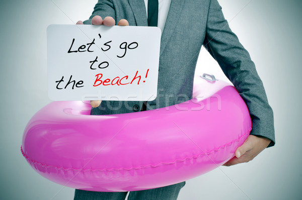 Plajă om de afaceri roz înot inel Imagine de stoc © nito