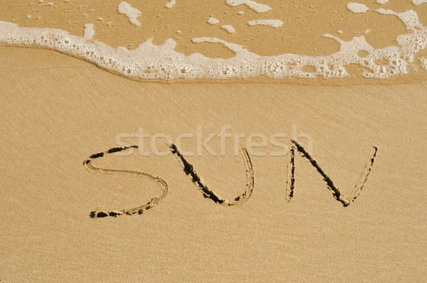 Słońce piasku słowo napisany plaży wody Zdjęcia stock © nito