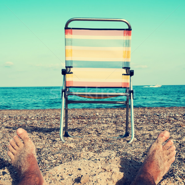 chair and young man on the beach, filtered Stock photo © nito