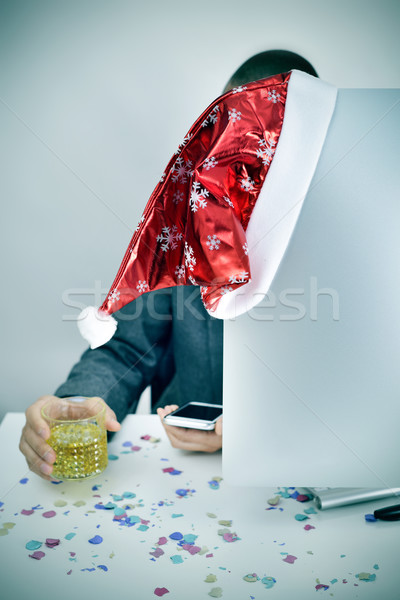 Férfi üveg szeszes ital mikulás kalap iroda Stock fotó © nito