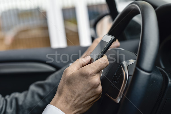 businessman using a smartphone in a car Stock photo © nito