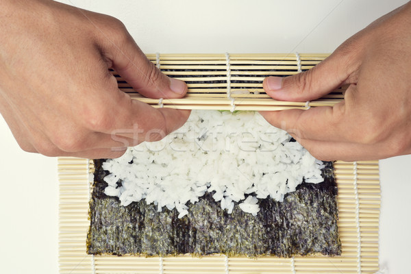 young man preparing makizushi Stock photo © nito