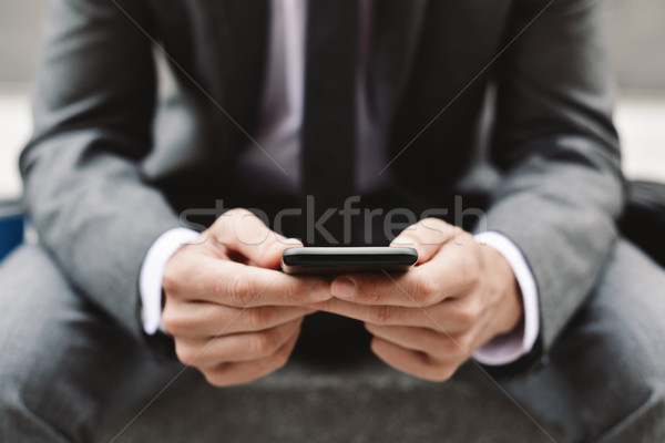 young businessman using a smartphone Stock photo © nito