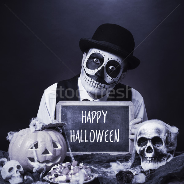 disguised man with chalkboard with text happy halloween, b&w Stock photo © nito