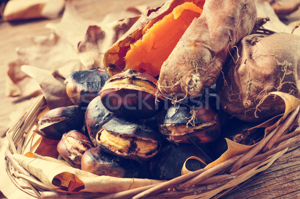 Stock photo: roasted chestnuts and roasted sweet potatoes in a basket