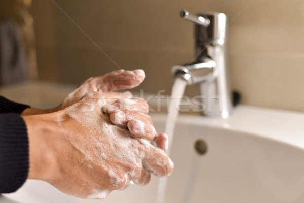 young man washing hands Stock photo © nito