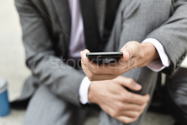 young businessman using a smartphone Stock photo © nito