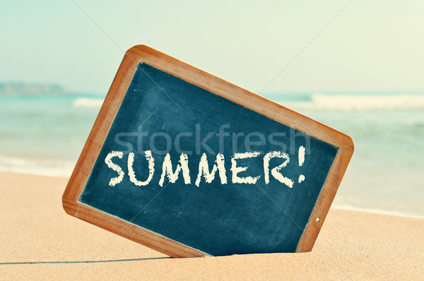 word summer in a chalkboard, on the sand of a beach Stock photo © nito