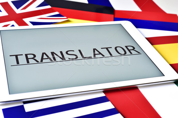 different flags and the word translator in the screen of a table Stock photo © nito