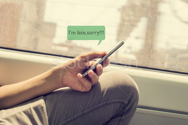 young man writing a message to apologize Stock photo © nito
