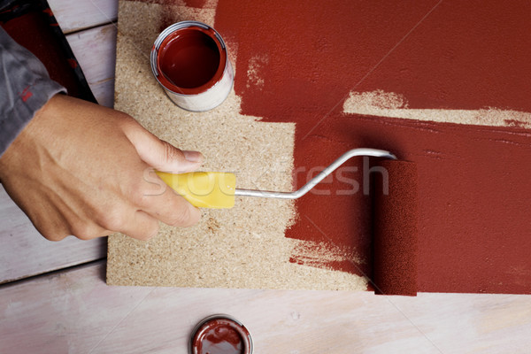 young man painting a wooden board Stock photo © nito