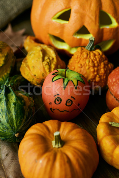 apple disguised as a pumpkin between different pumpkins Stock photo © nito