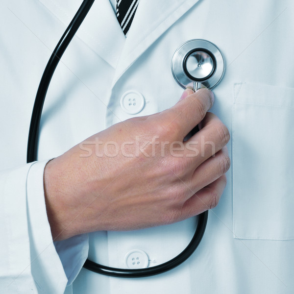 doctor auscultating himself with a stethoscope Stock photo © nito