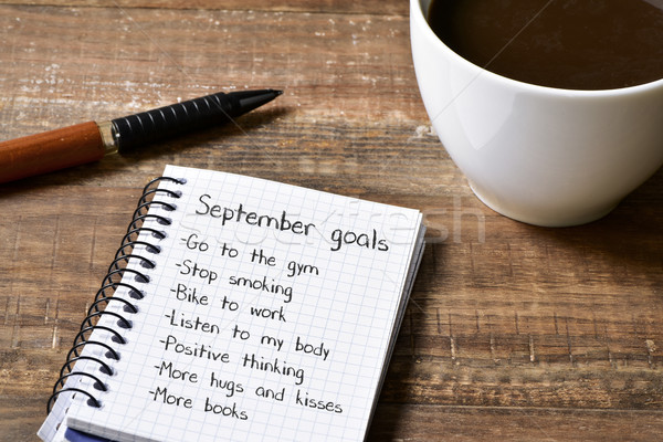 coffee and notepad with a list of September goals Stock photo © nito