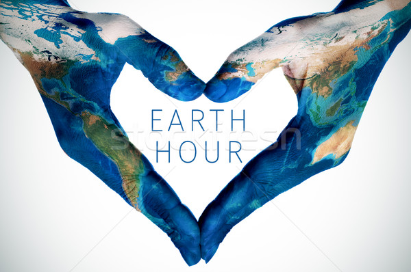 text earth hour and woman hands patterned with world map (furnis Stock photo © nito