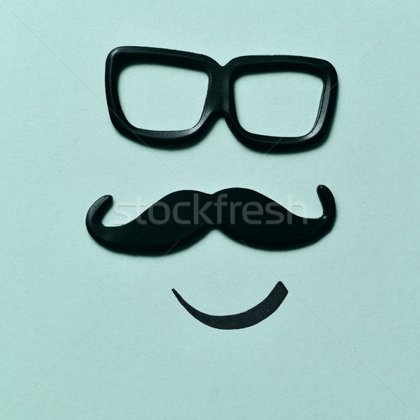 eyeglasses and mustache forming a face Stock photo © nito