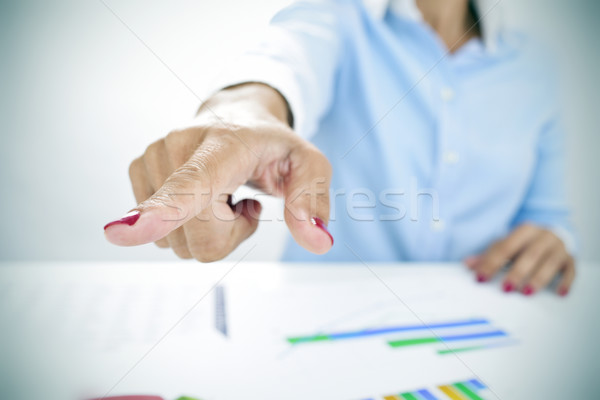 businesswoman pointing with her finger the way out Stock photo © nito