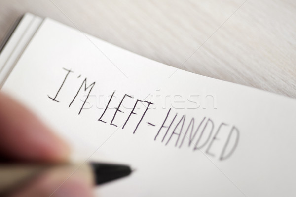 left-handed man writing the text I am left-handed Stock photo © nito