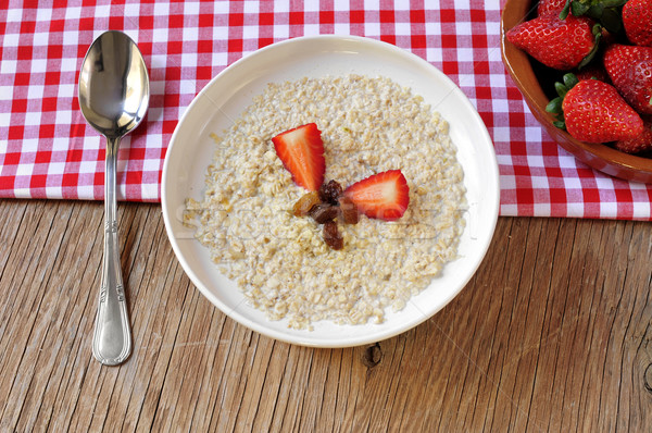 bowl with porridge on a set table for breakfast Stock photo © nito